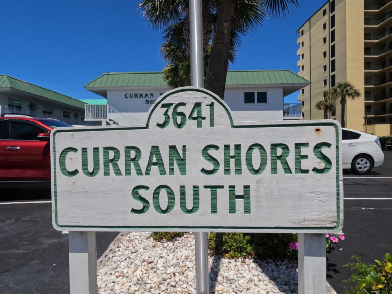 a photo of the signage to Curran Shores South Condominium