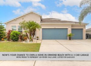 Front view of 259 River Vale Ln, Ormond Beach, showing landscaped yard and 3-car garage