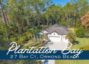 Aerial view of 27 Bay Ct, Ormond Beach, FL 32174 in Plantation Bay showing the front of the home and spacious lot.